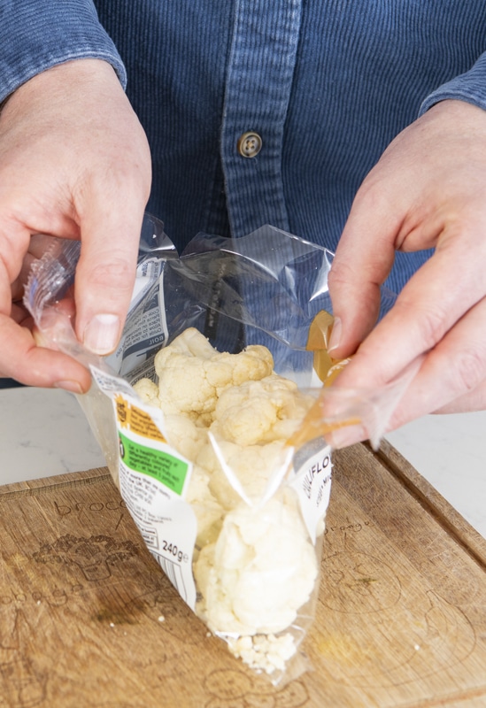 Pre-packed cauliflower on a kitchen worktop