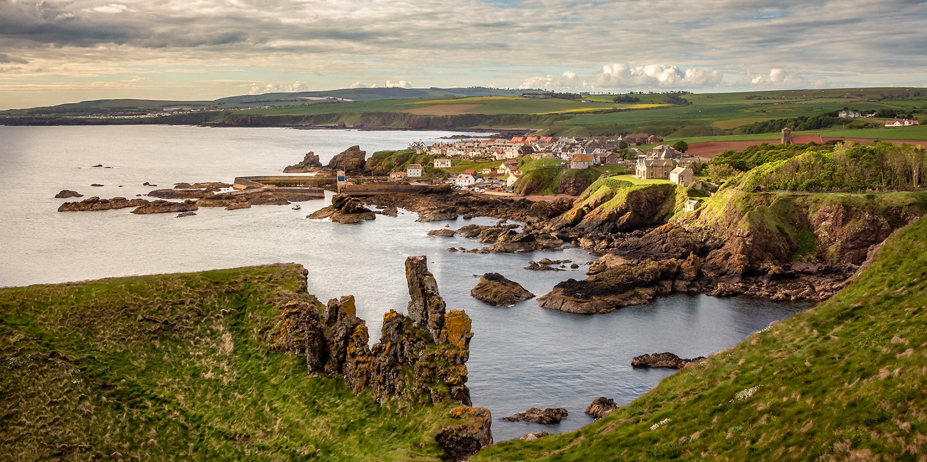 Panoramic seascape view of St. Abbs, small fishing village on the east coast of Scotland